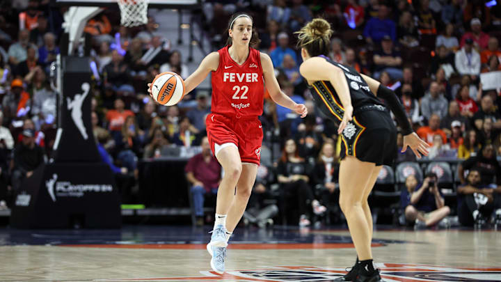 Sep 25, 2024; Uncasville, Connecticut, USA; Indiana Fever guard Caitlin Clark (22) dribbles the ball during the first half against the Connecticut Sun during game two of the first round of the 2024 WNBA Playoffs at Mohegan Sun Arena. Mandatory Credit: Paul Rutherford-Imagn Images Sep 25, 2024; Uncasville, Connecticut, USA; Indiana Fever guard Caitlin Clark (22) dribbles the ball during the first half against the Connecticut Sun during game two of the first round of the 2024 WNBA Playoffs at Mohegan Sun Arena. Mandatory Credit: Paul Rutherford-Imagn Images