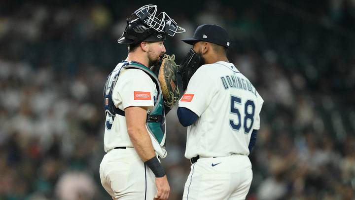 Aug 4, 2026; Seattle, Washington, USA; Seattle Mariners catcher Cal Raleigh (29) Seattle Mariners relief pitcher Seranthony Domínguez (58) talk during the ninth inning at T-Mobile Park. Mandatory Credit: Steven Bisig-Imagn Images Aug 4, 2026; Seattle, Washington, USA; Seattle Mariners catcher Cal Raleigh (29) Seattle Mariners relief pitcher Seranthony Domínguez (58) talk during the ninth inning at T-Mobile Park. Mandatory Credit: Steven Bisig-Imagn Images