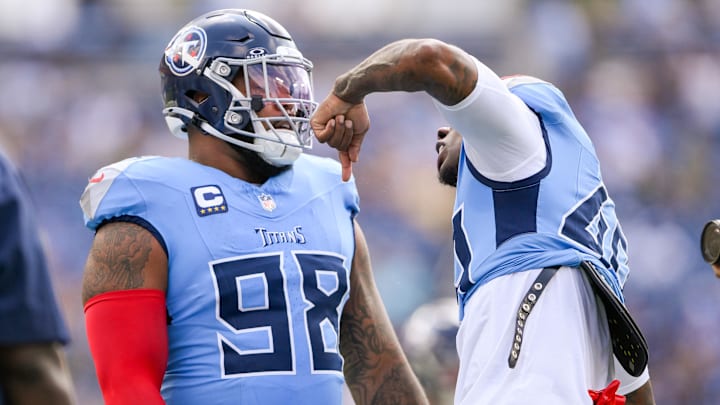 Tennessee Titans defensive tackle Jeffery Simmons (98) and linebacker Arden Key (49) speak during pregame warmups before the game against the Green Bay Packers at Nissan Stadium.