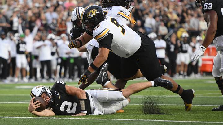 Oct 25, 2025; Nashville, Tennessee, USA; Vanderbilt Commodores quarterback Diego Pavia (2) is tackled near the goal line by Missouri Tigers defensive lineman Jalen Marshall (95) during the fourth quarter at FirstBank Stadium. Mandatory Credit: Steve Roberts-Imagn Images Oct 25, 2025; Nashville, Tennessee, USA; Vanderbilt Commodores quarterback Diego Pavia (2) is tackled near the goal line by Missouri Tigers defensive lineman Jalen Marshall (95) during the fourth quarter at FirstBank Stadium. Mandatory Credit: Steve Roberts-Imagn Images