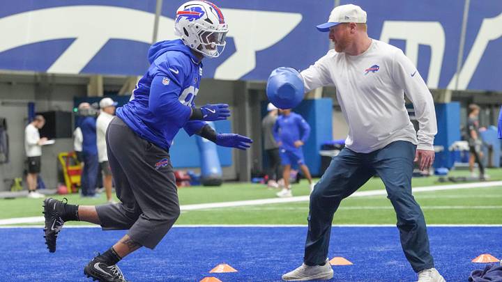 Buffalo Bills rookie outside linebacker T.J. Parker (99) perform a drill with OLBs coach Bobby April III (right) during Buffalo's mandatory veteran minicamp at One Bills Drive in Orchard Park, New York, on June 9, 2026. Buffalo Bills rookie outside linebacker T.J. Parker (99) perform a drill with OLBs coach Bobby April III (right) during Buffalo's mandatory veteran minicamp at One Bills Drive in Orchard Park, New York, on June 9, 2026.