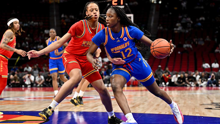 Apr 2, 2024; Houston, TX, USA; McDonald's All American East forward Joyce Edwards (12) drives to the basket against McDonald's All American West center Me'Arah O’Neal (13) during the first half at Toyota Center. Mandatory Credit: Maria Lysaker-Imagn Images
