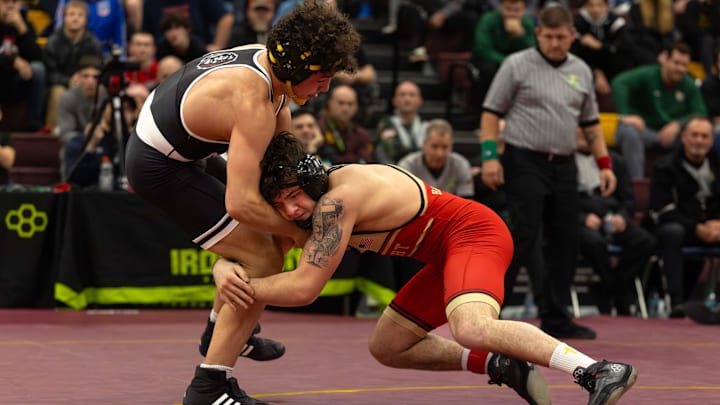 Bishop McCort's Bo Bassett faces Faith Christian Academy’s Joe Bachmann in the championship bout at the Ironman wrestling tournament at Walsh Jesuit High School in Cuyahoga Falls, Ohio on Dec. 13, 2025.