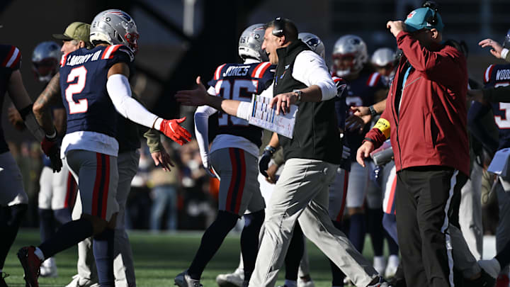 Nov 2, 2025; Foxborough, Massachusetts, USA;  New England Patriots head coach Mike Vrabel high fives linebacker Harold Landry III (2) during the first half against the Atlanta Falcons at Gillette Stadium. Mandatory Credit: Eric Canha-Imagn Images
