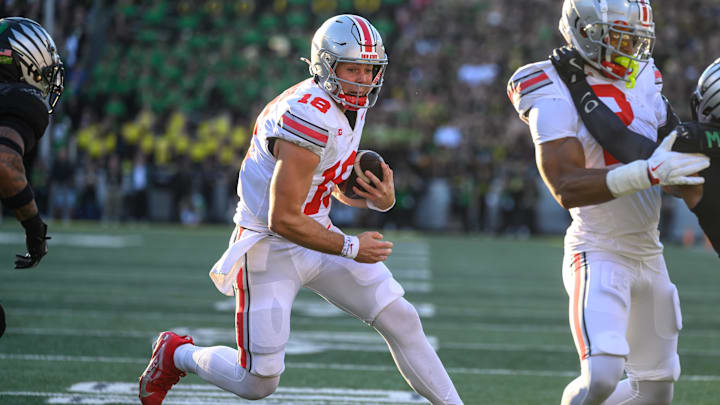 Oct 12, 2024; Eugene, Oregon, USA; Ohio State Buckeyes quarterback Will Howard (18) runs the ball during the first half against the Oregon Ducks at Autzen Stadium. Oct 12, 2024; Eugene, Oregon, USA; Ohio State Buckeyes quarterback Will Howard (18) runs the ball during the first half against the Oregon Ducks at Autzen Stadium.