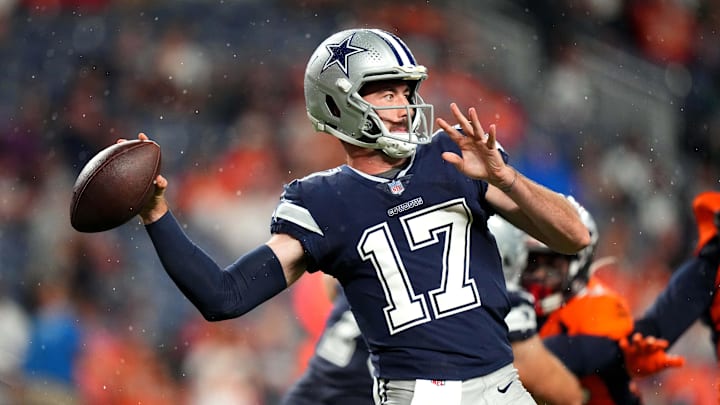Aug 13, 2022; Denver, Colorado, USA; Dallas Cowboys quarterback Ben DiNucci (17) prepares to pass the ball in the second half against the Denver Broncos at Empower Field at Mile High.