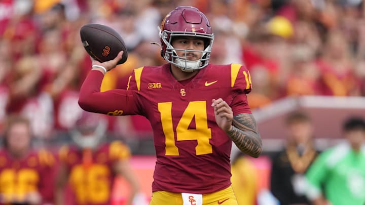 Nov 30, 2024; Los Angeles, California, USA; Southern California Trojans quarterback Jayden Maiava (14) throws the ball against the Notre Dame Fighting Irish in the first half at United Airlines Field at Los Angeles Memorial Coliseum. Mandatory Credit: Kirby Lee-Imagn Images