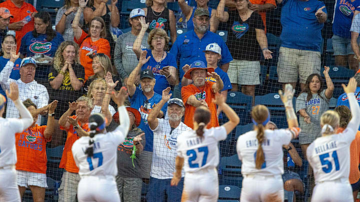 Gator fans celebrate with the team after an NCAA softball game at Katie Seashole Pressly Stadium in Gainesville, FL on Friday, April 18, 2025. Florida won 12-4 in the fifth inning. [Alan Youngblood/Gainesville Sun