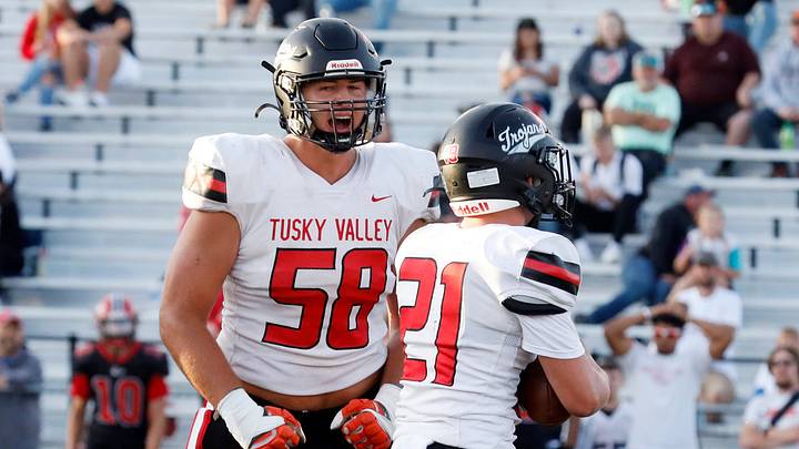 Ben Congdon, left, celebrates a tackle with Hunter Witts during Tuscarawas Valley's 29-23 loss to Coshocton on Friday, Aug. 29, 2025, at Stewart Field in Coshocton, Ohio. Congdon, a 6-8, 300-pound senior, is committed to Miami (Fla.) as on offensive lineman. Ben Congdon, left, celebrates a tackle with Hunter Witts during Tuscarawas Valley's 29-23 loss to Coshocton on Friday, Aug. 29, 2025, at Stewart Field in Coshocton, Ohio. Congdon, a 6-8, 300-pound senior, is committed to Miami (Fla.) as on offensive lineman.
