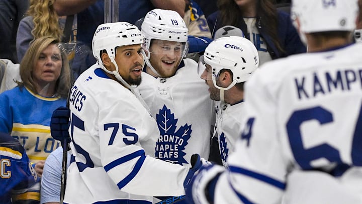 Nov 2, 2024; St. Louis, Missouri, USA;  Toronto Maple Leafs center Steven Lorentz (18) is congratulated by right wing Ryan Reaves (75) and defenseman Conor Timmins (25) after scoring against the St. Louis Blues during the third period at Enterprise Center. Mandatory Credit: Jeff Curry-Imagn Images