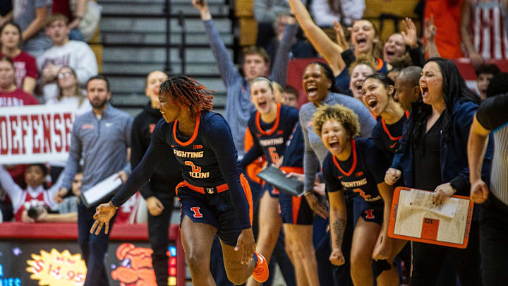 Illinois' Jasmine Brown-Hagger (8) shows three fingers as the Illinois' bench celebrates her three-pointer during the Indiana versus Illinois women's basketball game at Simon Skjodt Assembly Hall on Thursday, Jan. 16, 2025.