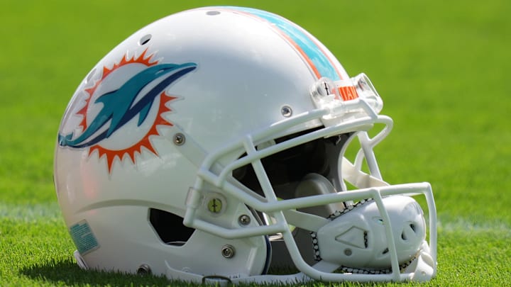 Aug 17, 2022; Miami Gardens, Florida, US; A general view of a Miami Dolphins helmet on the field during practice at Baptist Health Training Complex. Mandatory Credit: Jasen Vinlove-Imagn Images