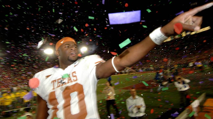 Jan 4, 2006; Pasadena, CA, USA; Texas Longhorns quarterback (10) Vince Young celebrates after defeating the Southern California Trojans 41-38 in the Rose Bowl Game at the Rose Bowl in Pasadena, California. Mandatory Credit: Mark J. Rebilas-Imagn Images Copyright © 2006 Mark J. Rebilas