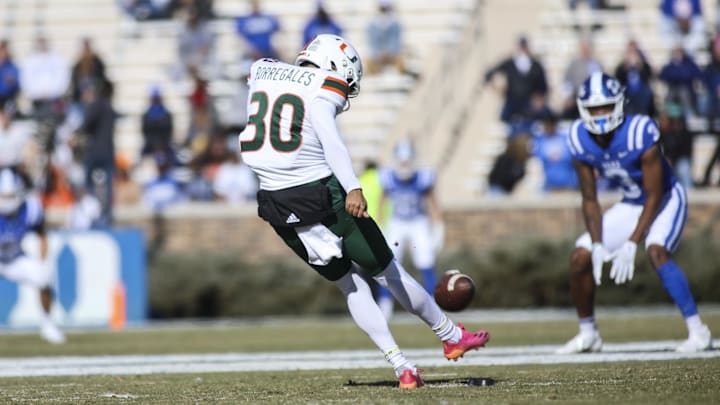 Nov 27, 2021; Durham, North Carolina, USA;  Miami Hurricanes place kicker Andres Borregales (30) kicks the football during the first half of the game against the Miami Hurricanes at Wallace Wade Stadium. at Wallace Wade Stadium. Mandatory Credit: Jaylynn Nash-Imagn Images