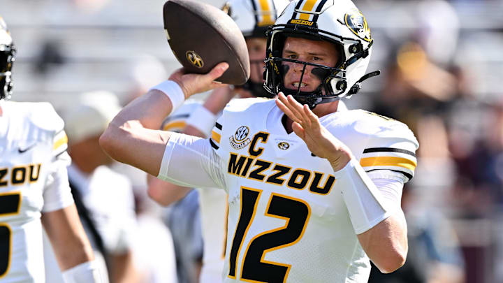 Oct 5, 2024; College Station, Texas, USA; Missouri Tigers quarterback Brady Cook (12) warms up prior to the against the Texas A&M Aggies at Kyle Field. Mandatory Credit: Maria Lysaker-Imagn Images. 
