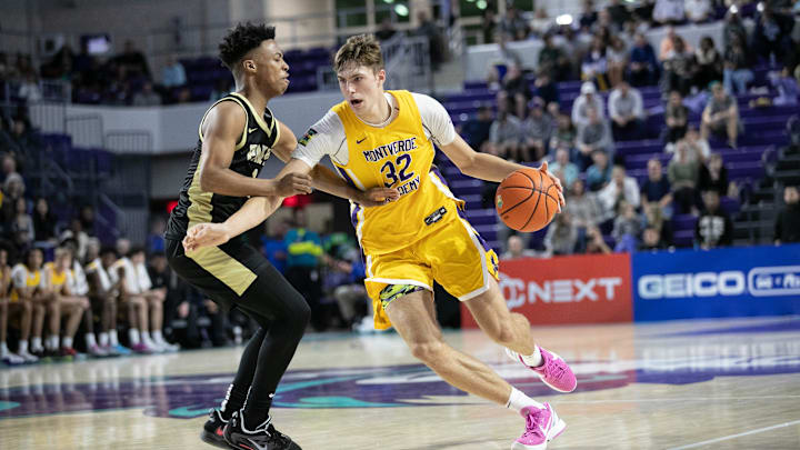 Duke basketball signee Cooper Flagg drives past Anthony Brown of Paul VI at the City of Palms Classic