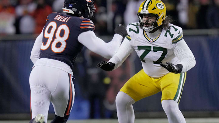 Green Bay Packers guard Jordan Morgan (77) blocks Chicago Bears defensive end Montez Sweat (98) during the second quarter of their game Saturday, December 20, 2025 at Soldier Field in Chicago, Illinois.