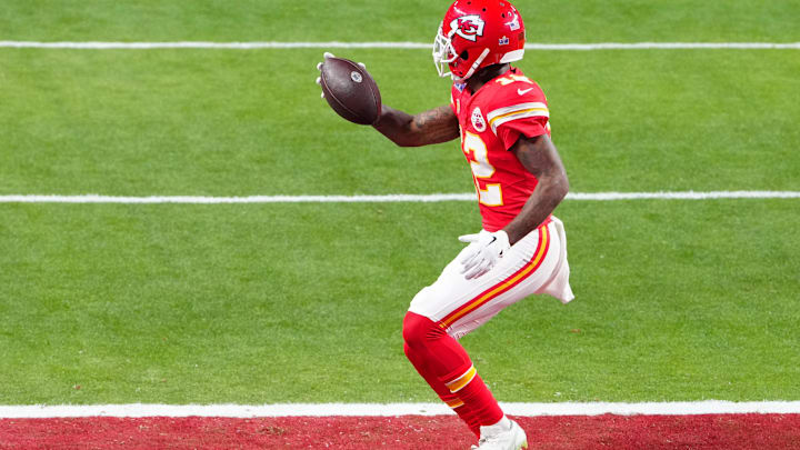Feb 11, 2024; Paradise, Nevada, USA;  Kansas City Chiefs wide receiver Mecole Hardman Jr. (12) scores the winning touchdown against the San Francisco 49ers during overtime in Super Bowl LVIII at Allegiant Stadium. Mandatory Credit: Stephen R. Sylvanie-Imagn Images