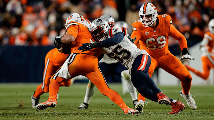 Dec 24, 2023; Denver, Colorado, USA; Denver Broncos quarterback Russell Wilson (3) is sacked by New England Patriots linebacker Josh Uche (55) as offensive tackle Mike McGlinchey (69) defends in the third quarter at Empower Field at Mile High.