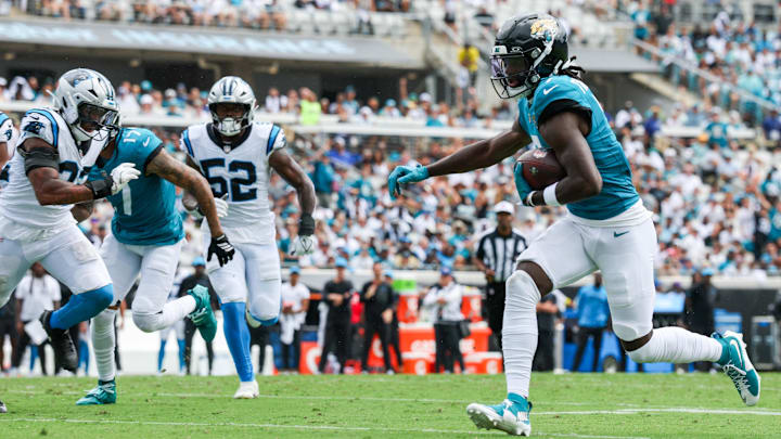 Jacksonville Jaguars wide receiver Brian Thomas Jr. (7) carries the ball for a 9-yard touchdown against the Carolina Panthers