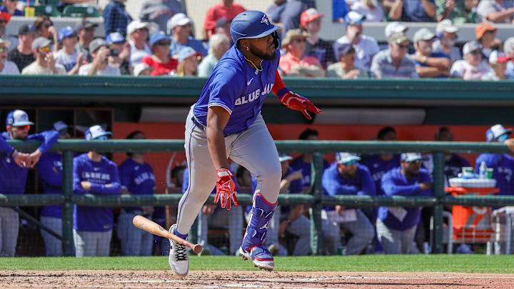 Mar 3, 2025: Toronto Blue Jays first baseman Vladimir Guerrero Jr. (27) watches a fly ball on the way to first during the fourth inning against the Toronto Blue Jays at Publix Field at Joker Marchant Stadium. 