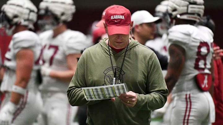 April 9, 2024; Tuscaloosa, Alabama, USA; Alabama head coach Kalen DeBoer checks his play sheet