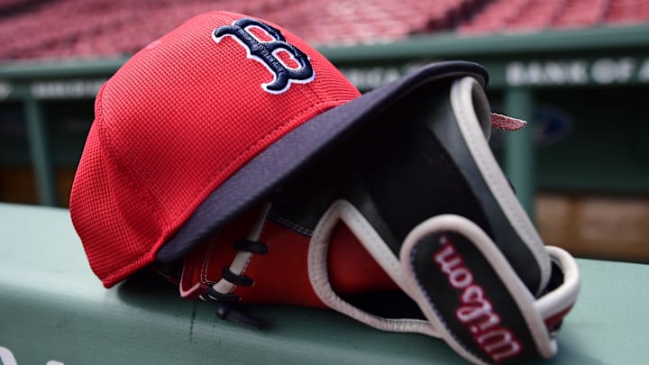 May 18, 2025; Boston, Massachusetts, USA; A Boston Red Sox hat and glove rests on the railing by the dugout prior to a game against the Atlanta Braves at Fenway Park. Mandatory Credit: Bob DeChiara-Imagn Images May 18, 2025; Boston, Massachusetts, USA; A Boston Red Sox hat and glove rests on the railing by the dugout prior to a game against the Atlanta Braves at Fenway Park. Mandatory Credit: Bob DeChiara-Imagn Images