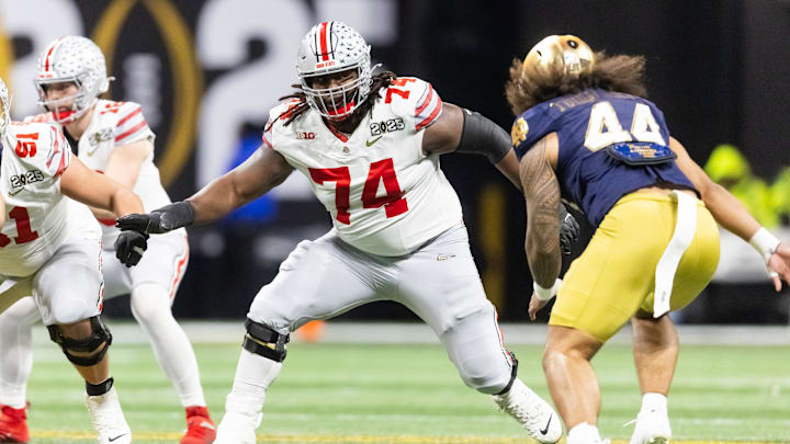 Ohio State Buckeyes offensive lineman Donovan Jackson (74) against the Notre Dame Fighting Irish during the CFP National Championship college football game at Mercedes-Benz Stadium. 