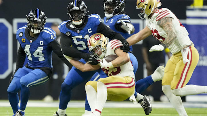 Dec 22, 2025; Indianapolis, Indiana, USA; Indianapolis Colts defensive end Kwity Paye (51) tackles San Francisco 49ers running back Christian McCaffrey (23) during the fourth quarter at Lucas Oil Stadium. Mandatory Credit: Grace Hollars-USA TODAY Network via Imagn Images