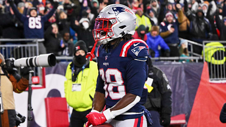 Jan 4, 2026; Foxborough, Massachusetts, USA; New England Patriots running back Rhamondre Stevenson (38) reacts after catching a fifteen-yard touchdown pass thrown by quarterback Drake Maye (not pictured) against the Miami Dolphins during the fourth quarter at Gillette Stadium. Mandatory Credit: Brian Fluharty-Imagn Images