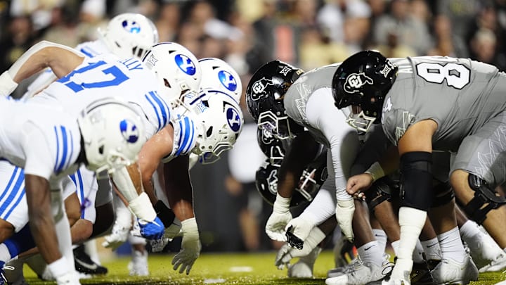 Sep 27, 2025; Boulder, Colorado, USA; Members of the Brigham Young Cougars against the Colorado Buffaloes during the first quarter at Folsom Field. Mandatory Credit: Ron Chenoy-Imagn Images