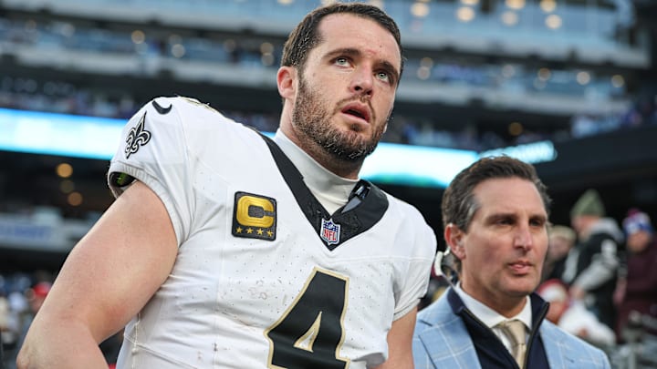 Dec 8, 2024; East Rutherford, New Jersey, USA; New Orleans Saints quarterback Derek Carr (4) walks off the field after field after an injury during the fourth quarter at MetLife Stadium. 