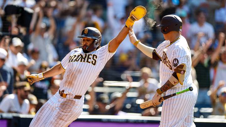 Aug 12, 2026; San Diego, California, USA; San Diego Padres right fielder Fernando Tatis Jr. (23) celebrates with third baseman Manny Machado (13) after scoring a run during the eighth inning against the Milwaukee Brewers at Petco Park. Mandatory Credit: David Frerker-Imagn Images Aug 12, 2026; San Diego, California, USA; San Diego Padres right fielder Fernando Tatis Jr. (23) celebrates with third baseman Manny Machado (13) after scoring a run during the eighth inning against the Milwaukee Brewers at Petco Park. Mandatory Credit: David Frerker-Imagn Images