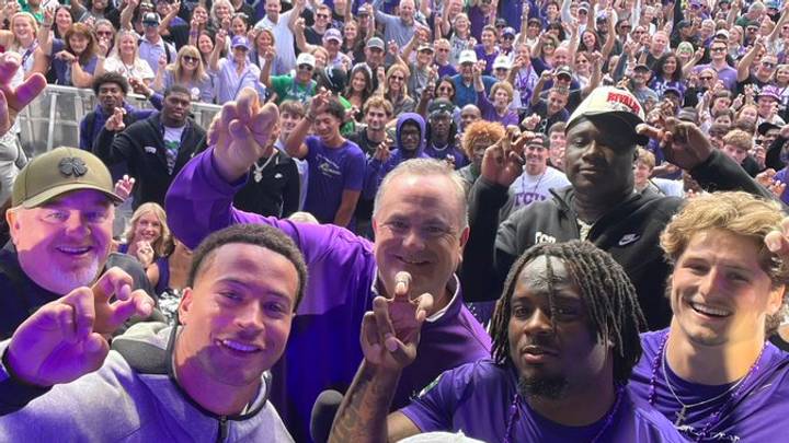 Members of the TCU football community pose with fans in a crowd of Horned Frogs supporters. Members of the TCU football community pose with fans in a crowd of Horned Frogs supporters.