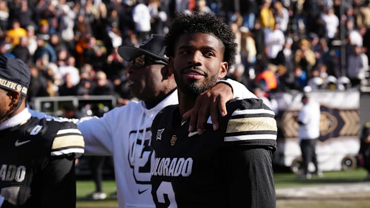 Nov 29, 2024; Boulder, Colorado, USA; Colorado Buffaloes quarterback Shedeur Sanders (2) and head coach Deion Sanders ifollowing the win over the Oklahoma State Cowboys at Folsom Field. Mandatory Credit: Ron Chenoy-Imagn Images Nov 29, 2024; Boulder, Colorado, USA; Colorado Buffaloes quarterback Shedeur Sanders (2) and head coach Deion Sanders ifollowing the win over the Oklahoma State Cowboys at Folsom Field. Mandatory Credit: Ron Chenoy-Imagn Images