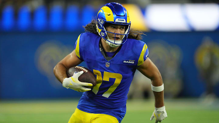 Los Angeles Rams wide receiver Puka Nacua (17) carries the ball against the Miami Dolphins at SoFi Stadium. 