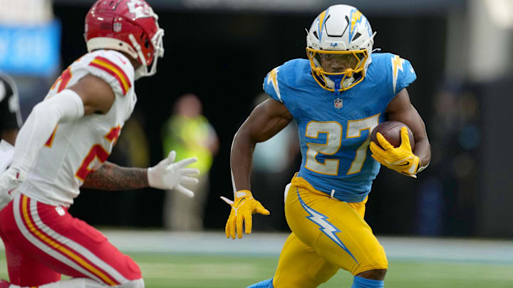 Sep 29, 2024; Inglewood, California, USA; Los Angeles Chargers running back J.K. Dobbins (27) carries the ball in the first quarter against the Kansas City Chiefs at SoFi Stadium. Mandatory Credit: Kirby Lee-Imagn Images