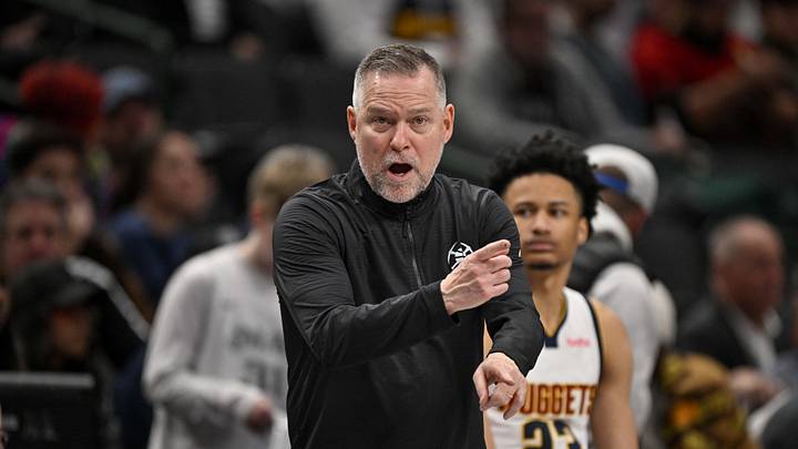Jan 14, 2025; Dallas, Texas, USA; Denver Nuggets head coach Michael Malone points to his team during the second half against the Dallas Mavericks at the American Airlines Center. Mandatory Credit: Jerome Miron-Imagn Images