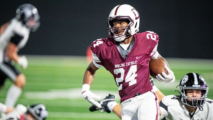 Dowling's Ra'Shawd Davis (24) carries the ball down the field during a playoff game against Ankeny Centennial on Friday, Nov. 8, 2024, at Mediacom Stadium.