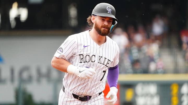 Jul 21, 2024; Denver, Colorado, USA; Colorado Rockies second base Brendan Rodgers (7) runs off a two run home run in the fourth inning against the San Francisco Giants at Coors Field. Mandatory Credit: Ron Chenoy-Imagn Images