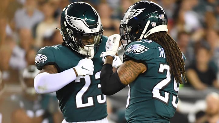 Former Philadelphia Eagles safety C.J. Gardner-Johnson (23) and former cornerback Avonte Maddox (29) celebrate against the Minnesota Vikings at Lincoln Financial Field. ]