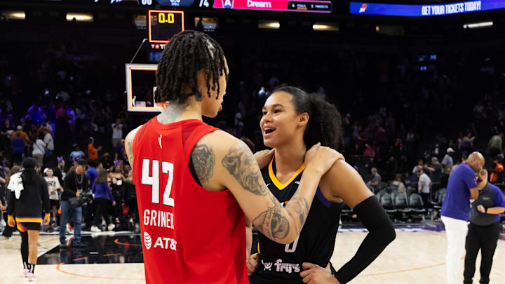 Aug 10, 2025; Phoenix, Arizona, USA; Atlanta Dream center Brittney Griner (42) greets Phoenix Mercury forward Satou Sabally (0) following the game at PHX Arena. Mandatory Credit: Mark J. Rebilas-Imagn Images