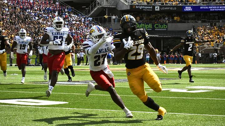 Sep 6, 2025; Columbia, Missouri, USA; Missouri Tigers running back Ahmad Hardy (29) evades a defender during a touchdown run against the Kansas Jayhawks at Faurot Field at Memorial Stadium. Sep 6, 2025; Columbia, Missouri, USA; Missouri Tigers running back Ahmad Hardy (29) evades a defender during a touchdown run against the Kansas Jayhawks at Faurot Field at Memorial Stadium.