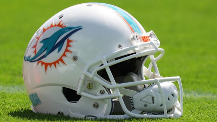 Aug 17, 2022; Miami Gardens, Florida, US; A general view of a Miami Dolphins helmet on the field during practice at Baptist Health Training Complex. Mandatory Credit: Jasen Vinlove-Imagn Images