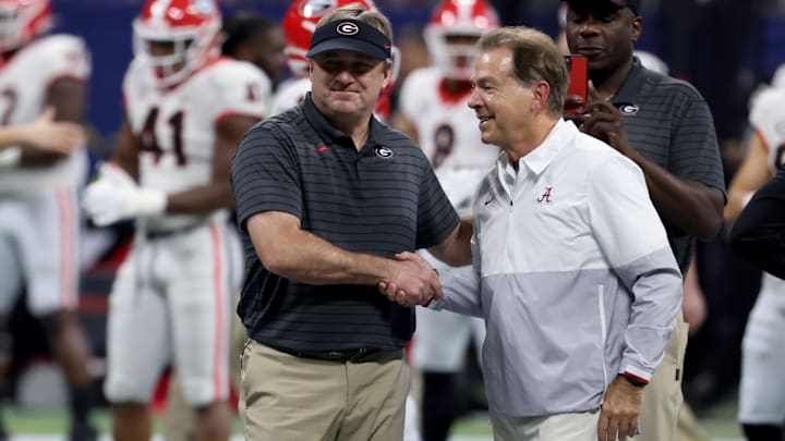 Dec 4, 2021; Atlanta, GA, USA; Georgia Bulldogs head coach Kirby Smart greets Alabama Crimson Tide head coach Nick Saban before the SEC championship game at Mercedes-Benz Stadium. Mandatory Credit: Jason Getz-Imagn Images