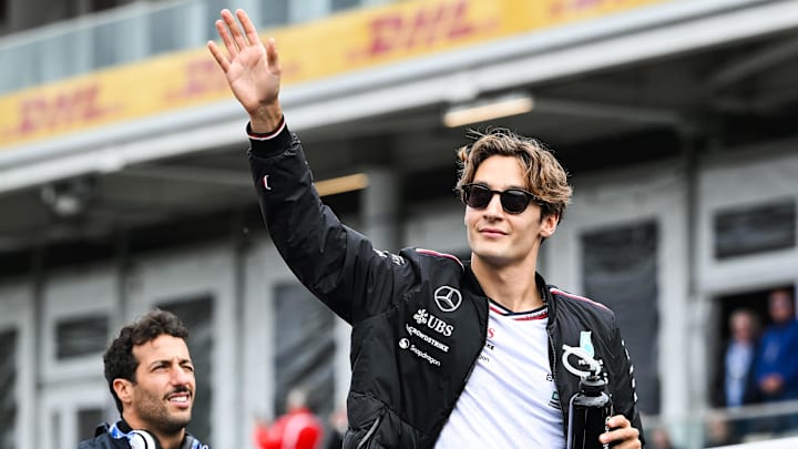 Jun 9, 2024; Montreal, Quebec, CAN; Mercedes driver George Russell (GBR) salutes the crowd during the drivers parade of the Canadien Grand Prix at Circuit Gilles Villeneuve. Mandatory Credit: David Kirouac-USA TODAY Sports