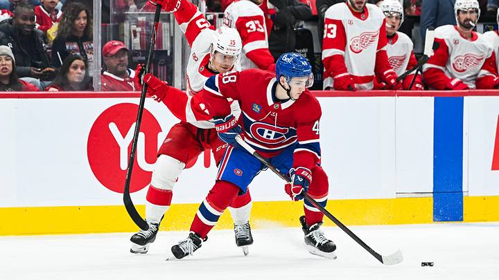Montreal Canadiens defenseman Lane Hutson (48) plays the puck against Detroit Red Wings center Sheldon Dries (15) during the second period at Bell Centre. Mandatory Credit: David Kirouac-Imagn Images Montreal Canadiens defenseman Lane Hutson (48) plays the puck against Detroit Red Wings center Sheldon Dries (15) during the second period at Bell Centre. Mandatory Credit: David Kirouac-Imagn Images