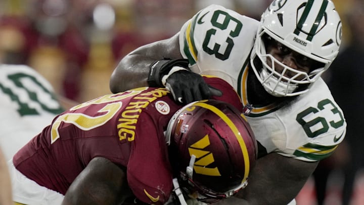 Green Bay Packers offensive tackle Rasheed Walker (63) blocks Washington Commanders defensive end Dorance Armstrong (92) during the second quarter of their game Thursday, September 11, 2025 at Lambeau Field in Green Bay, Wisconsin.