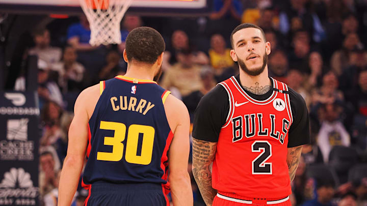 Jan 23, 2025; San Francisco, California, USA; Golden State Warriors guard Stephen Curry (30) walks around Chicago Bulls guard Lonzo Ball (2) after missing a half court shot at the buzzer of the first quarter at Chase Center. Mandatory Credit: Kelley L Cox-Imagn Images