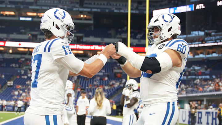 Sep 14, 2025; Indianapolis, Indiana, USA; Indianapolis Colts quarterback Daniel Jones (17) and center Tanor Bortolini (60) warm up prior to the game against the Denver Broncos at Lucas Oil Stadium. Sep 14, 2025; Indianapolis, Indiana, USA; Indianapolis Colts quarterback Daniel Jones (17) and center Tanor Bortolini (60) warm up prior to the game against the Denver Broncos at Lucas Oil Stadium.